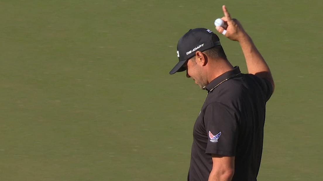 Gary Woodland hears the crowd roar after long birdie putt on iconic 16th hole