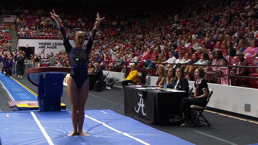 LSU's Kailin Chio celebrates after landing a phenomenal vault