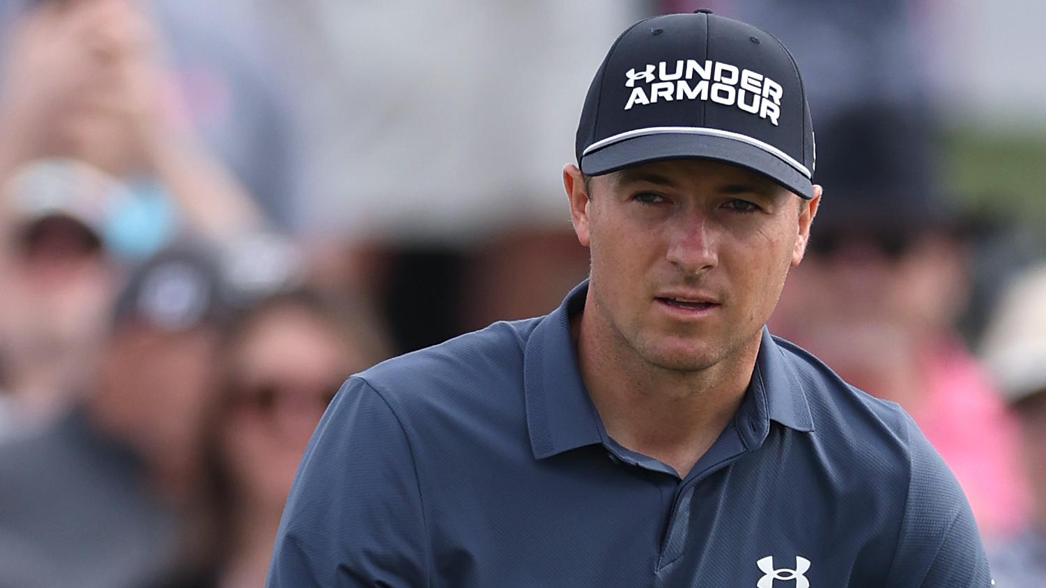 Jordan Spieth hears roar from the crowd after long birdie putt