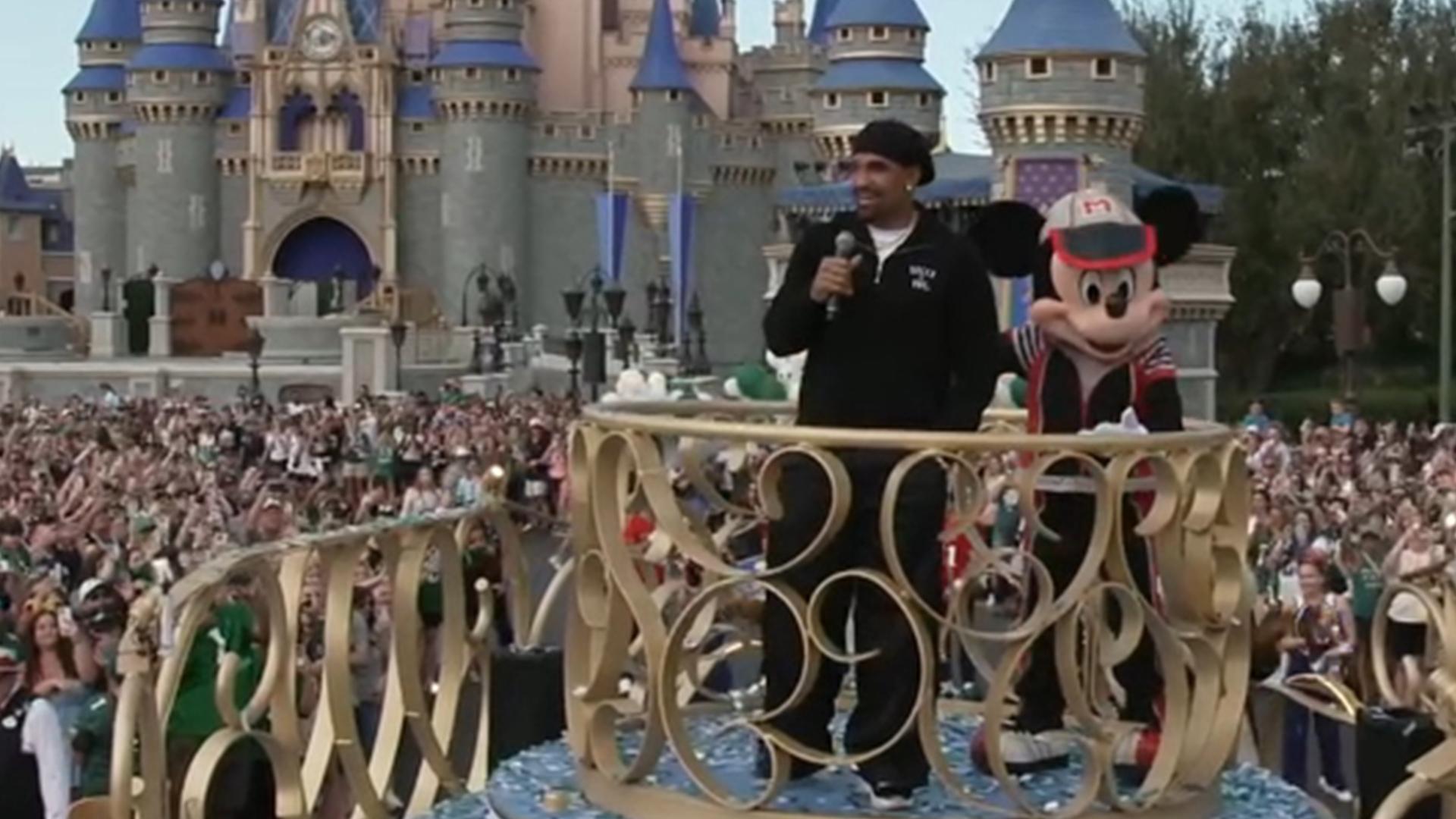 Jalen Hurts greets Eagles fans from a float in Disney parade