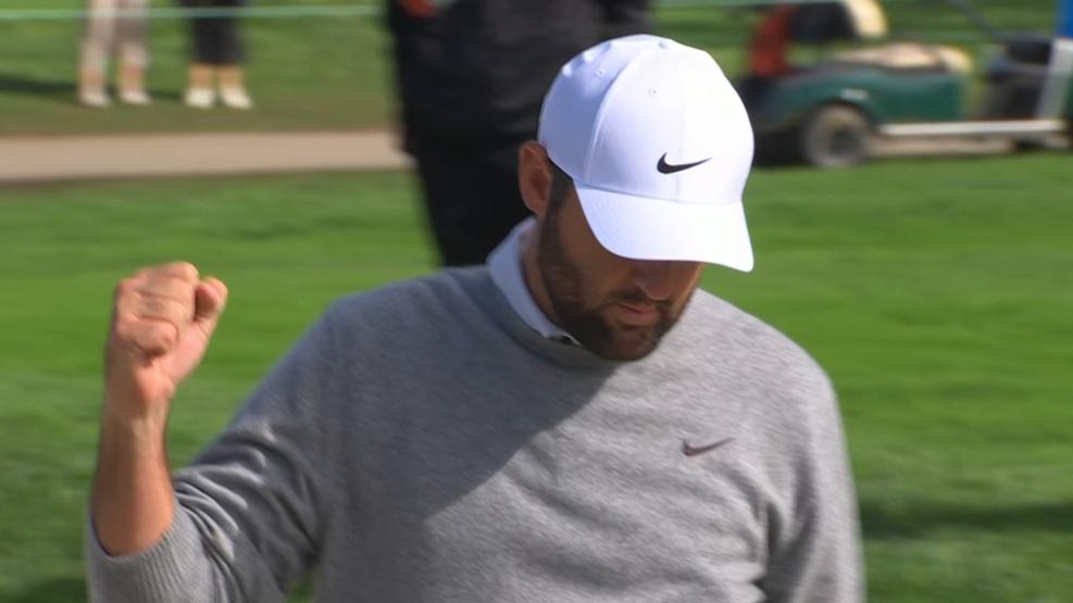 Scottie Scheffler chips from the bunker for eagle