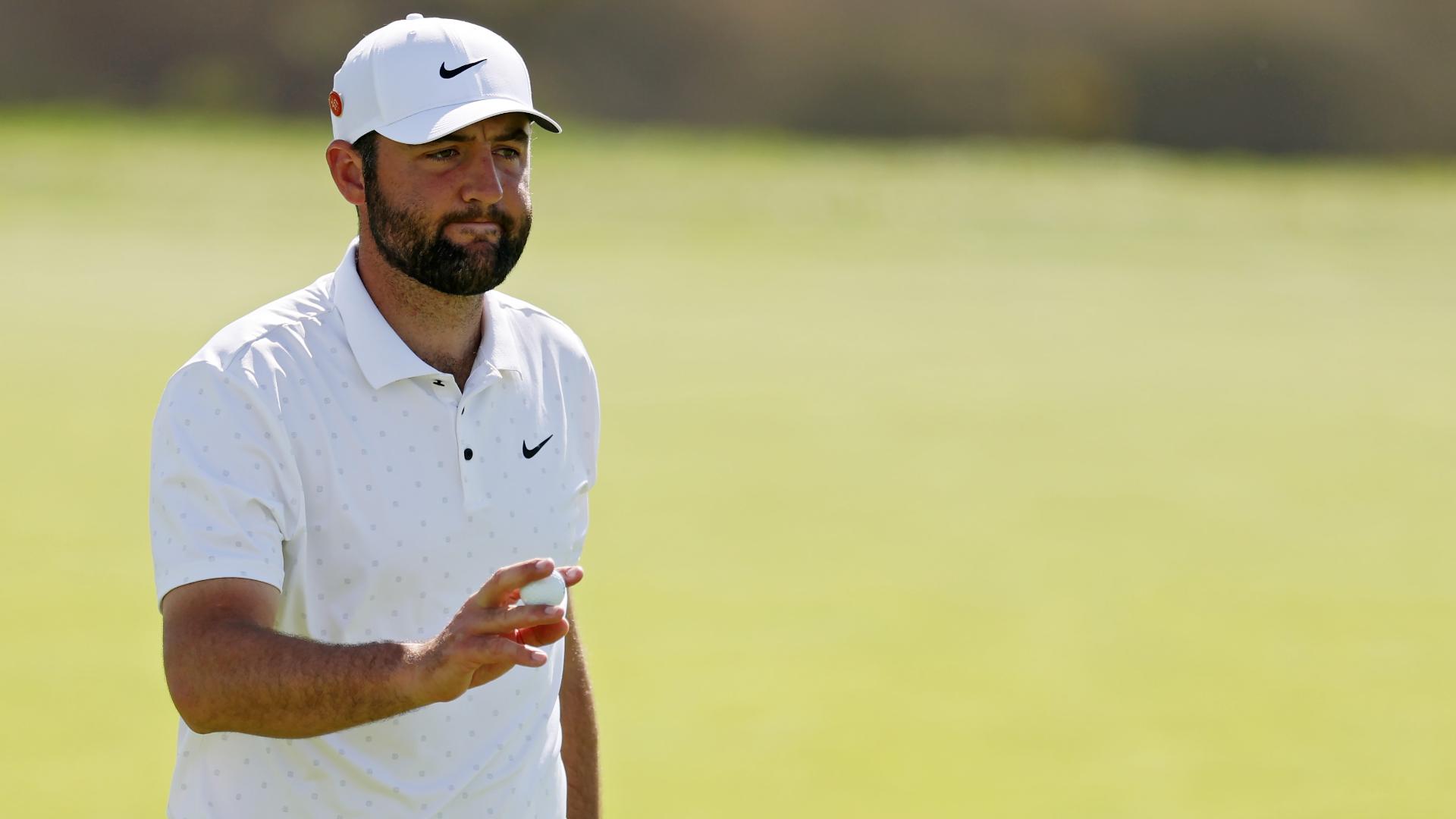 Scottie Scheffler hears a roar after chipping in for birdie