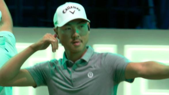 Min Woo Lee celebrates with the crowd after chipping in to win hole