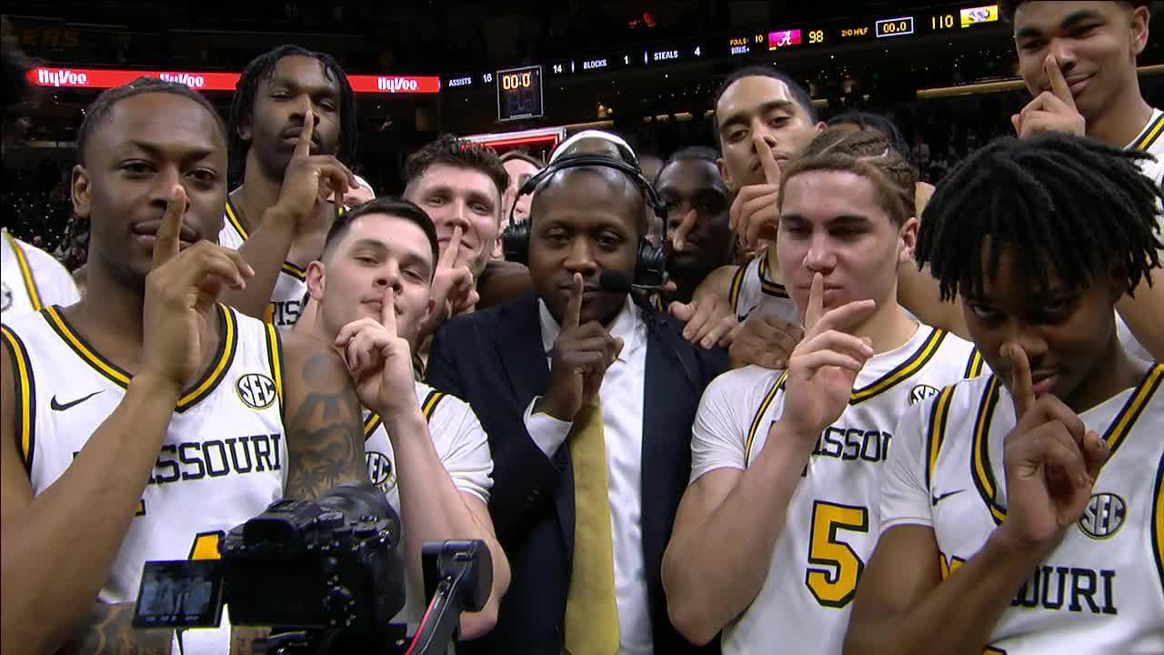 Mizzou players swarm their coach during interview