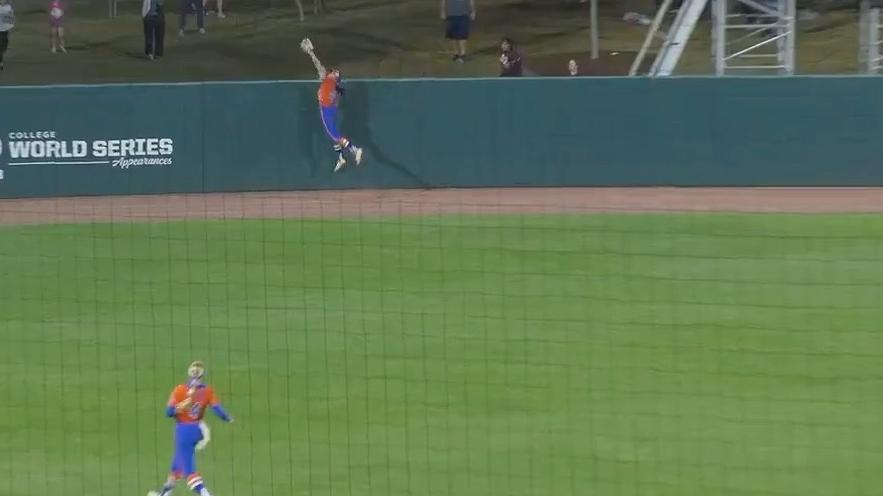 Florida's Kendra Falby leaps to rob a grand slam