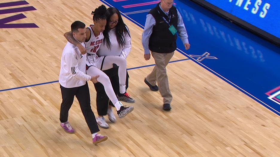 Aziaha James carried off the court after hard fall