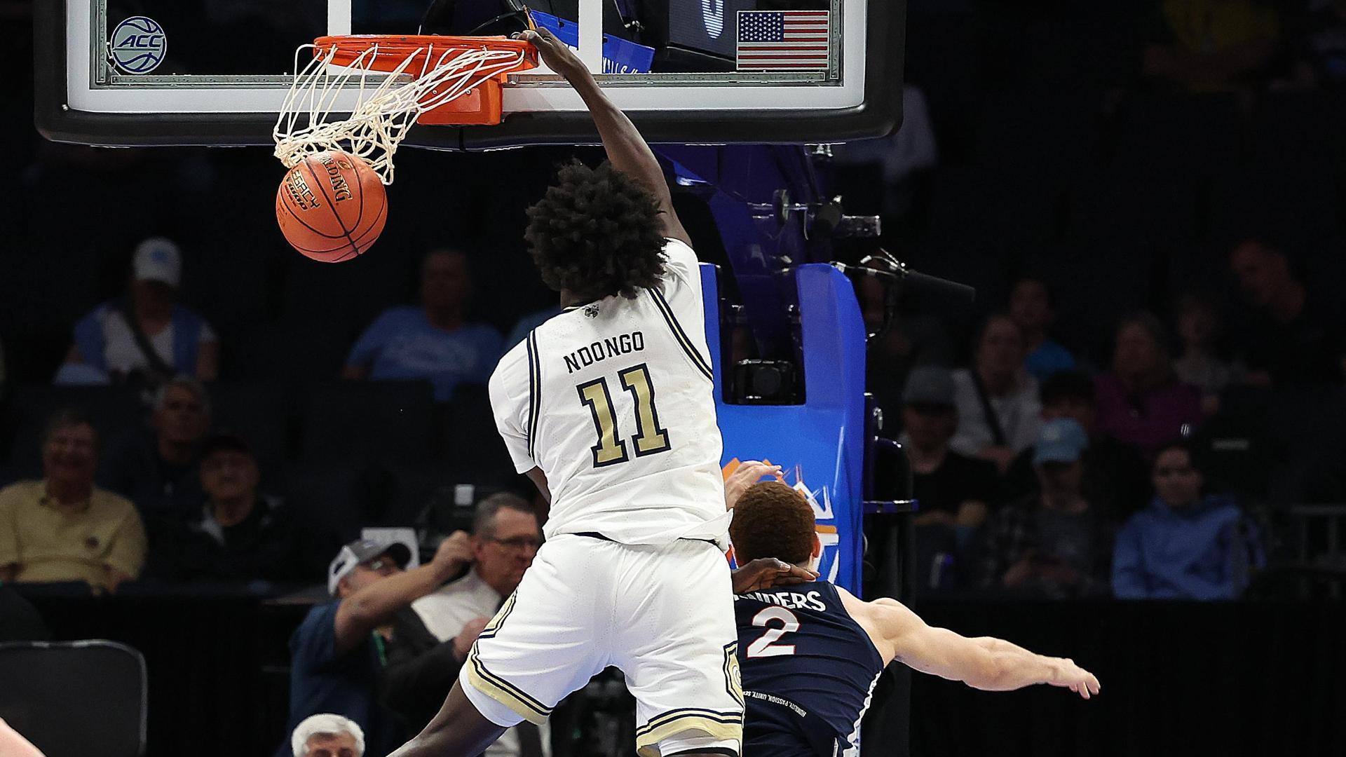 Georgia Tech's Baye Ndongo crams putback dunk on a defender