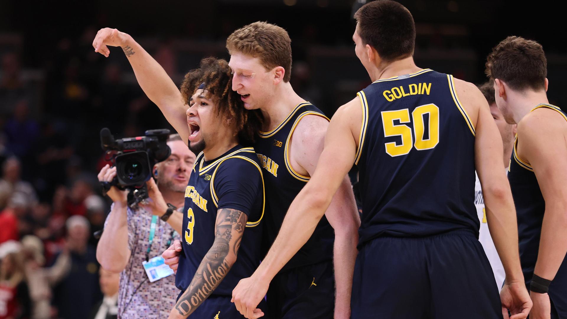 Tre Donaldson takes it all the way to win it for Michigan late