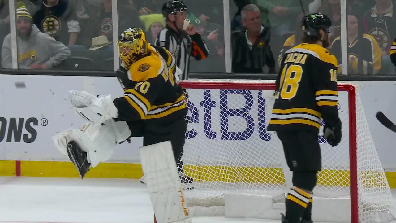 Frustrated Bruins goalie punts puck after no penalty call