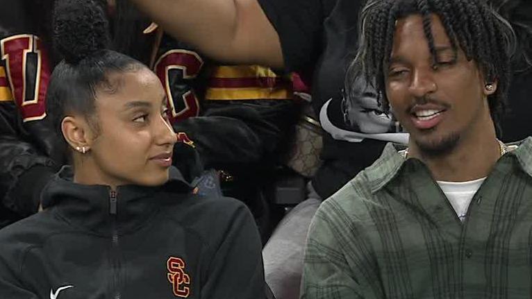 JuJu Watkins chats with Jayden Daniels during NCAA tournament