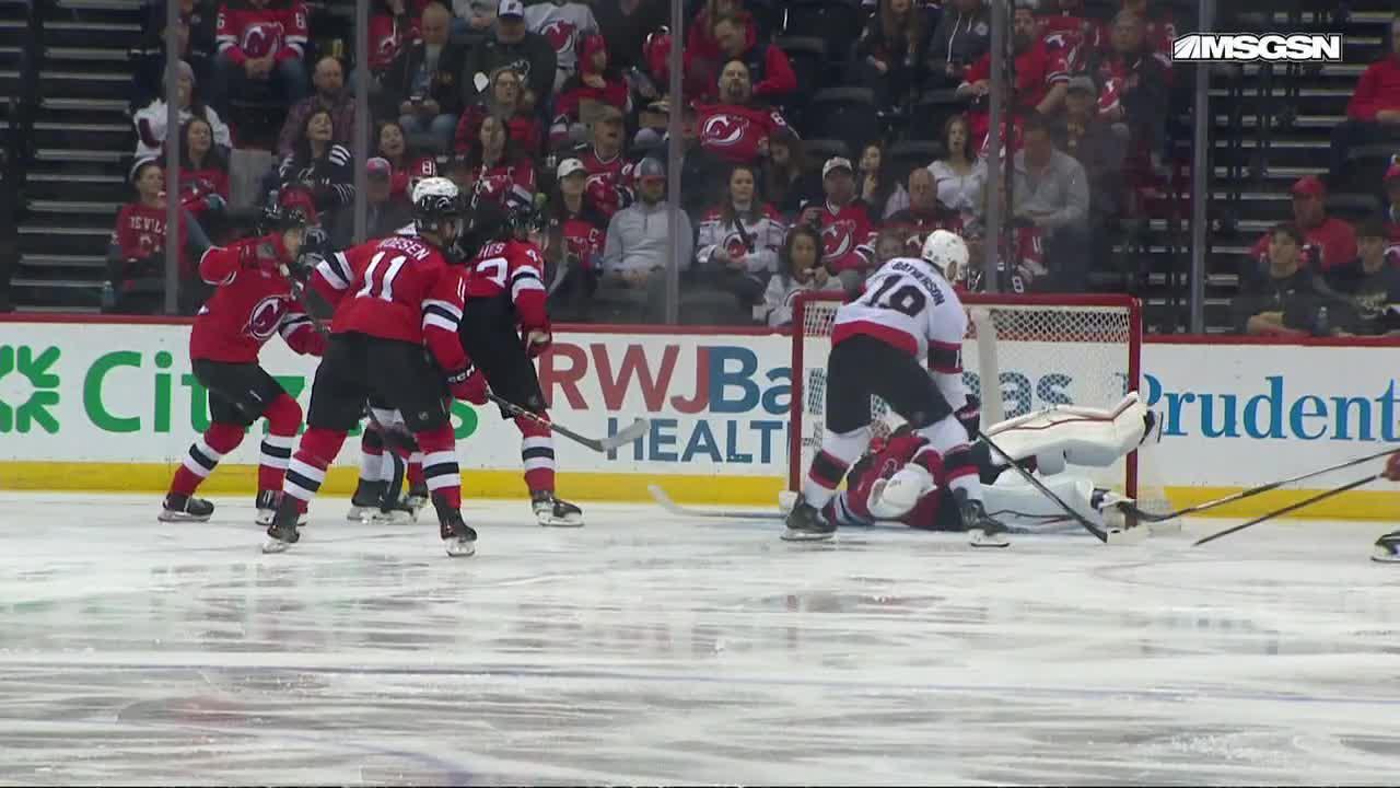 Jake Allen makes a fortunate pad save for the Devils