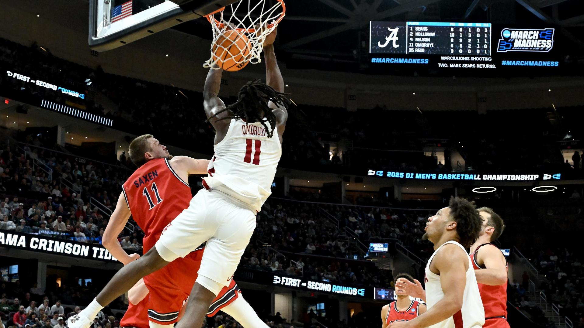 Alabama's Clifford Omoruyi slams home a reverse alley-oop