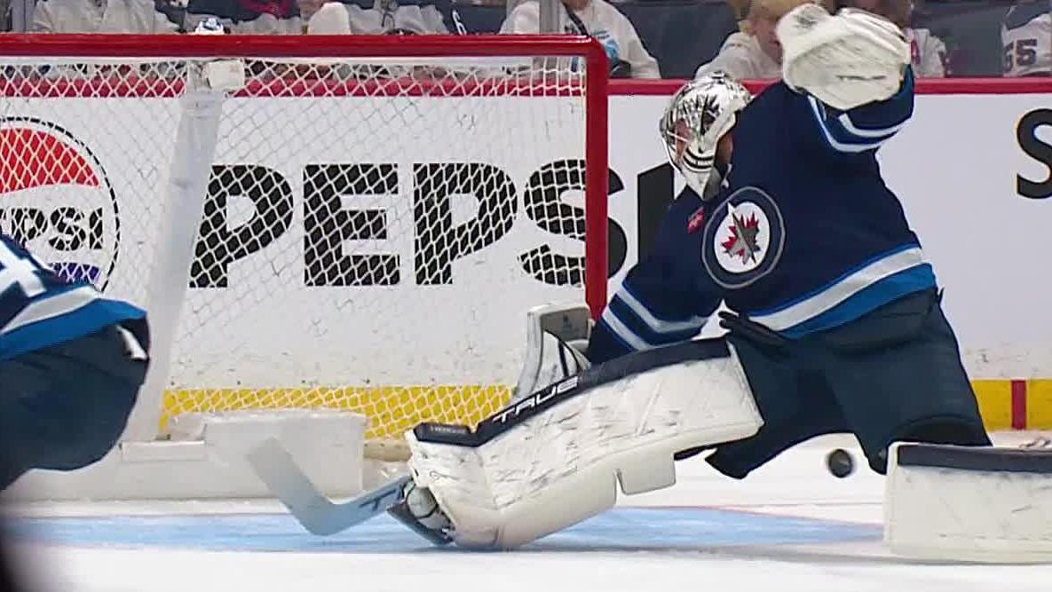 Connor Hellebuyck makes acrobatic save for Jets