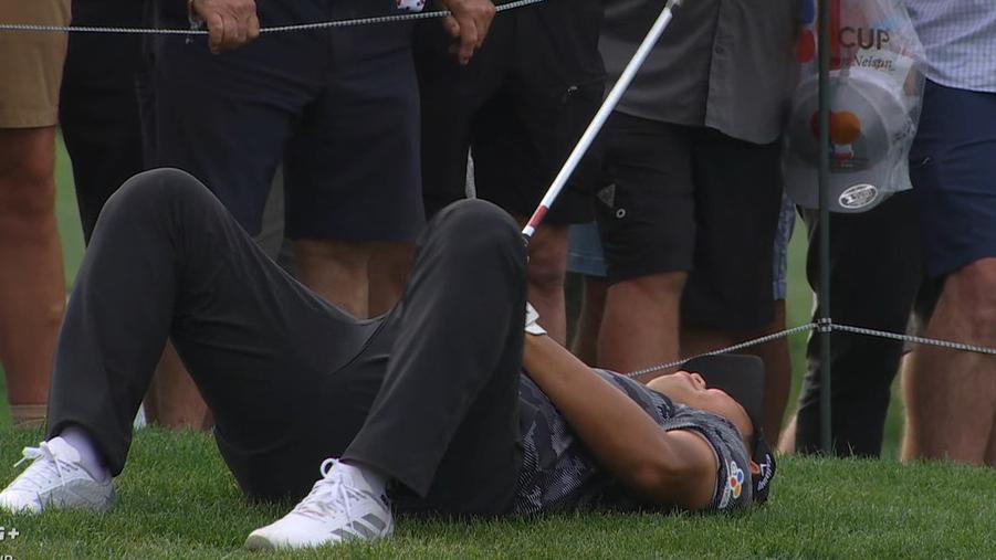 Si Woo Kim tumbles over in celebration after chipping in for eagle