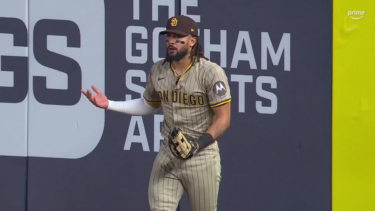 Tatis fakes out crowd after an impressive snag at the wall