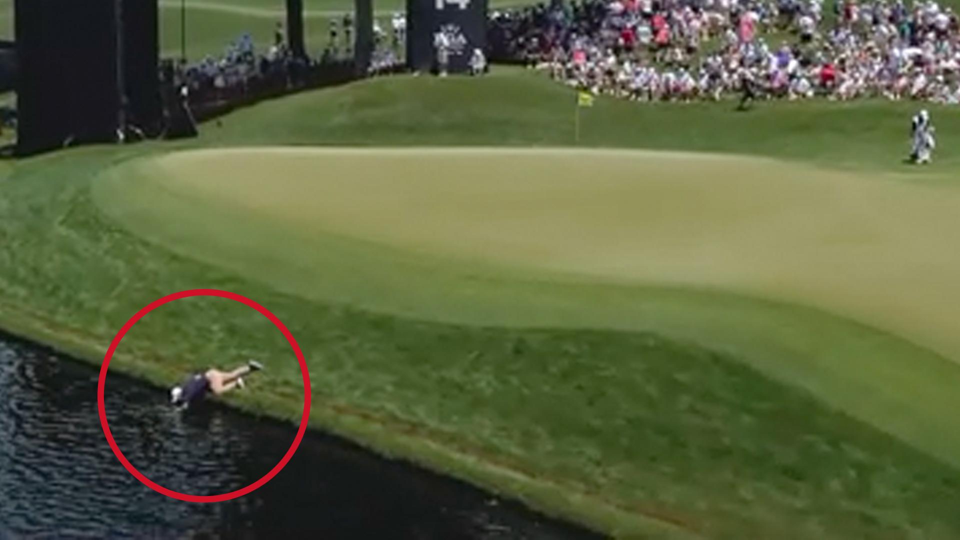 'Is that guy going in?!' Volunteer goes fishing for McIlroy's ball