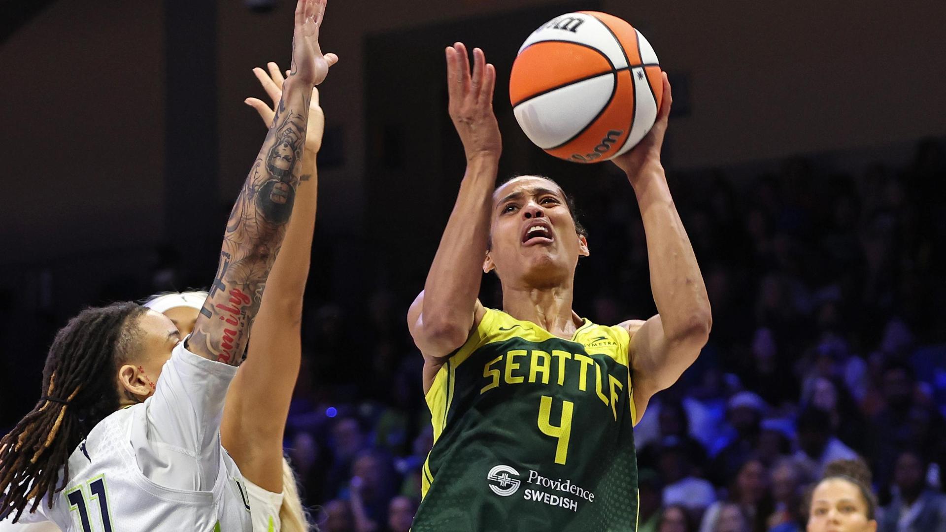 Skylar Diggins tosses up an and-1 for Storm