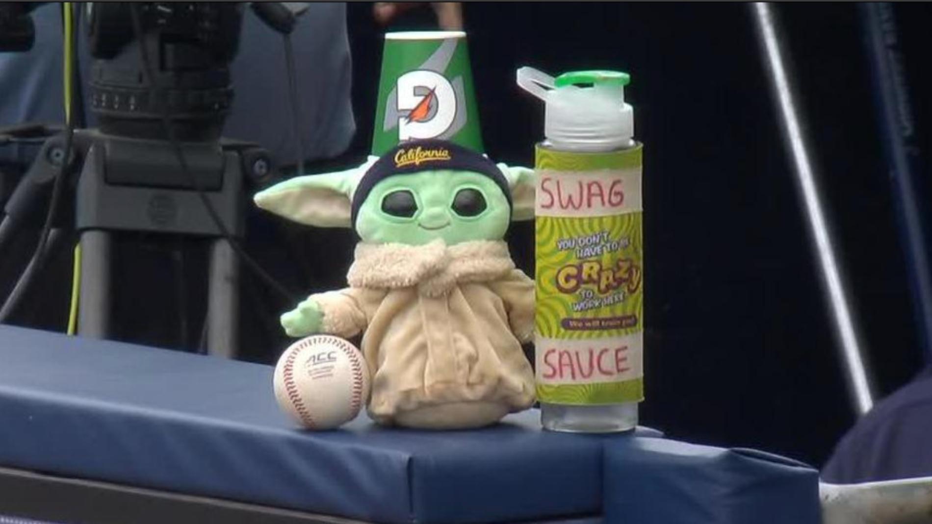 Baby Yoda embraces the Swag Sauce in the California dugout