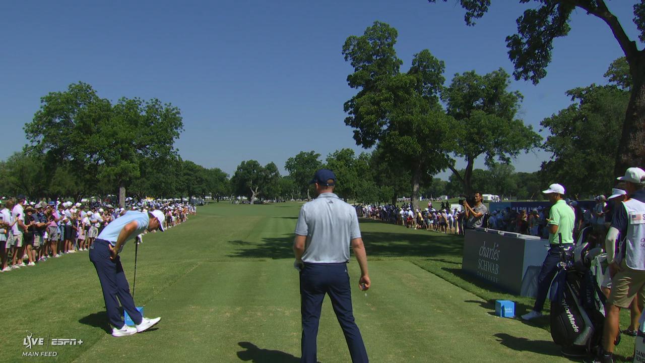 Scottie Scheffler winces in pain after tee shot