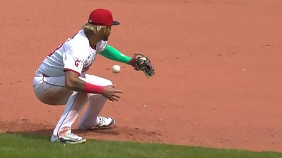 The baseball breaks through Gabriel Arias' glove
