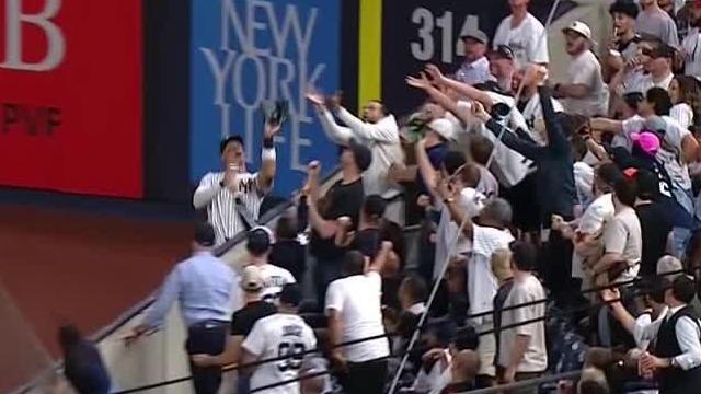 Fan interference helps end 6th inning for Yanks