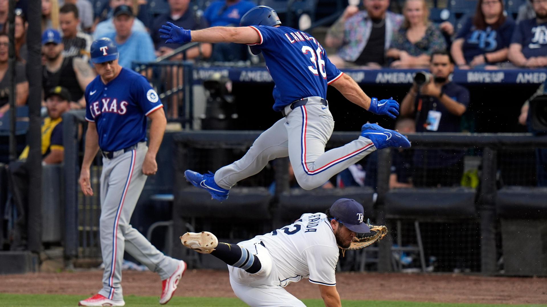 Wyatt Langford hurdles over 1B to avoid tag