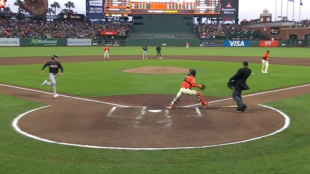 Ball thrown from crowd causes confusion on bizarre play at the plate