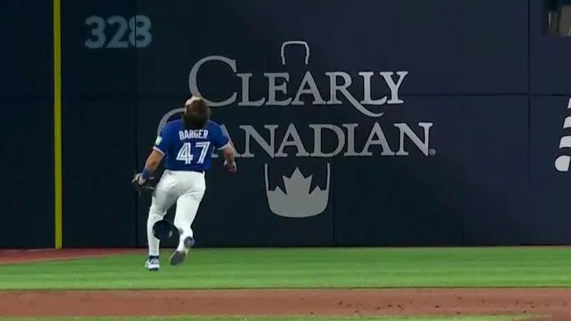 Addison Barger hustles a long way for slick over-the-shoulder grab