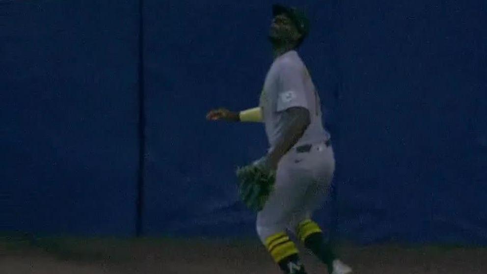 Denzel Clarke flashes the leather with leaping grab for A's