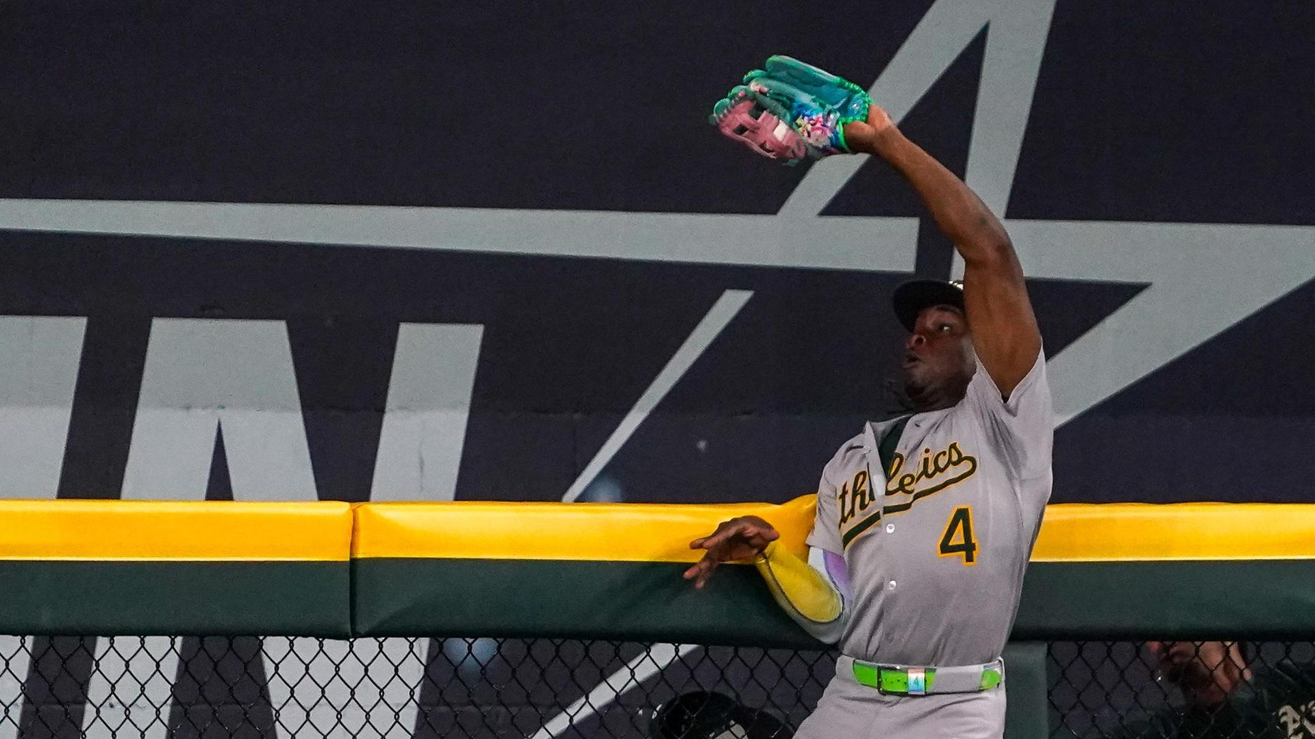 Lawrence Butler leaps for an amazing HR robbery