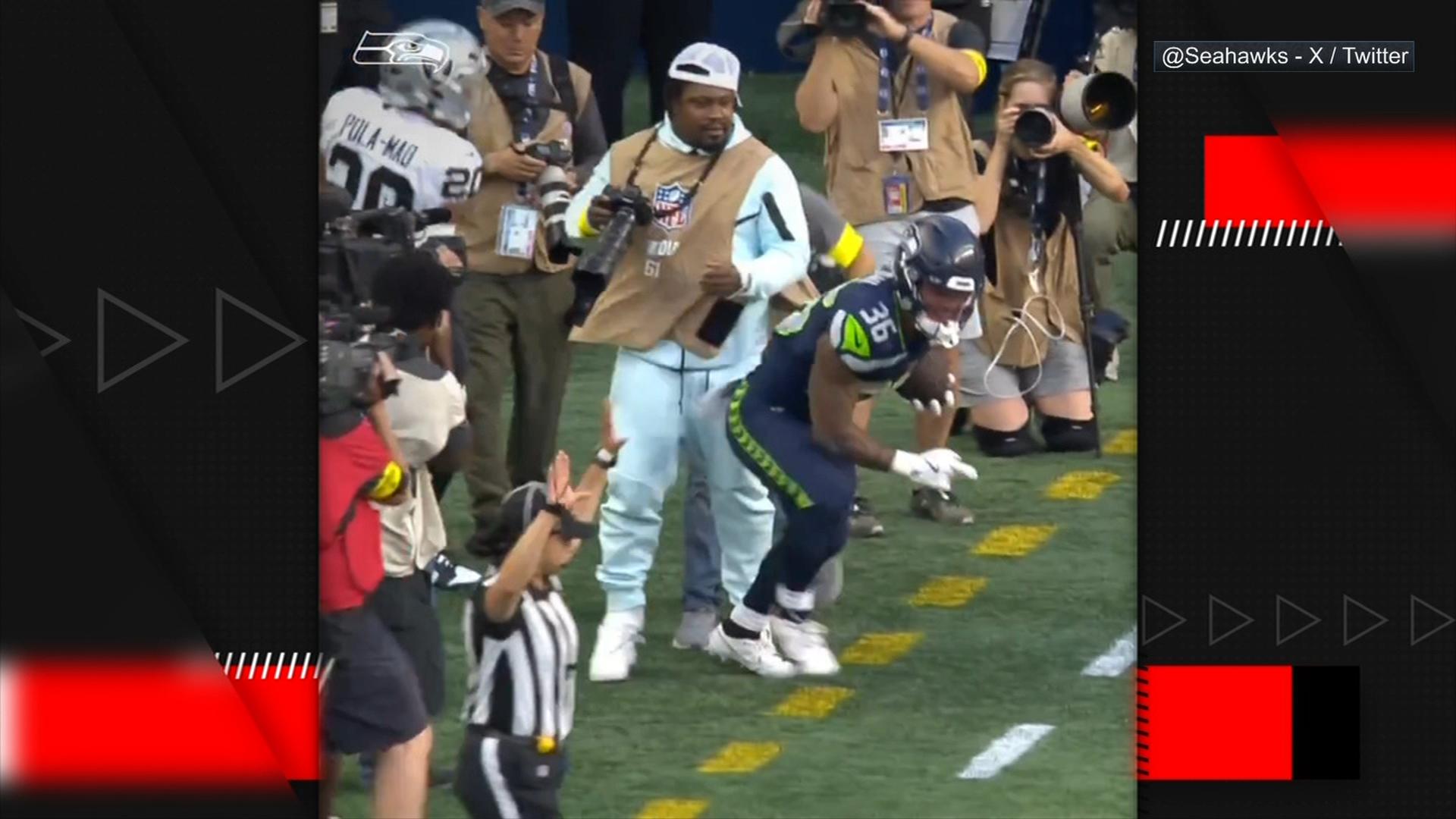 Marshawn Lynch protects his camera at all costs on sidelines