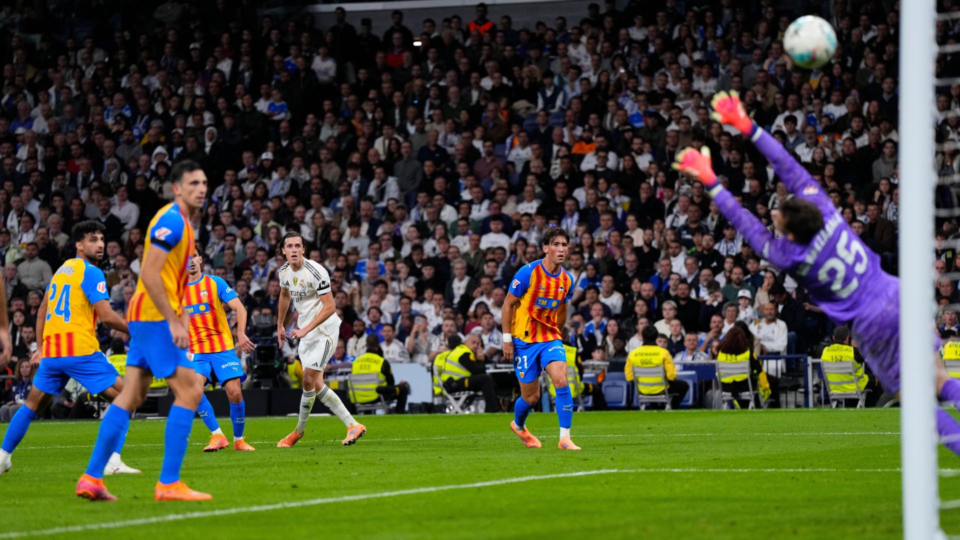 Álvaro Fernández slots in the goal for Real Madrid