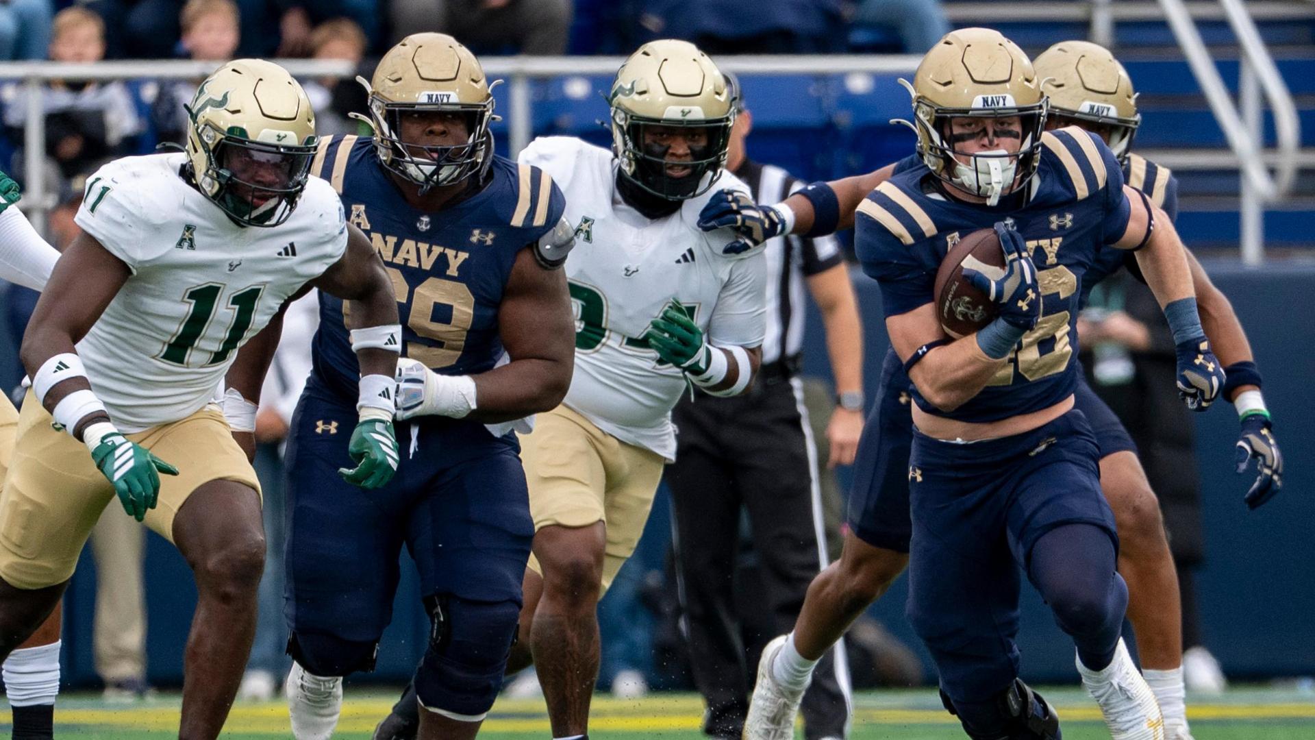 Alex Tecza bursts through for a 76-yard Navy TD