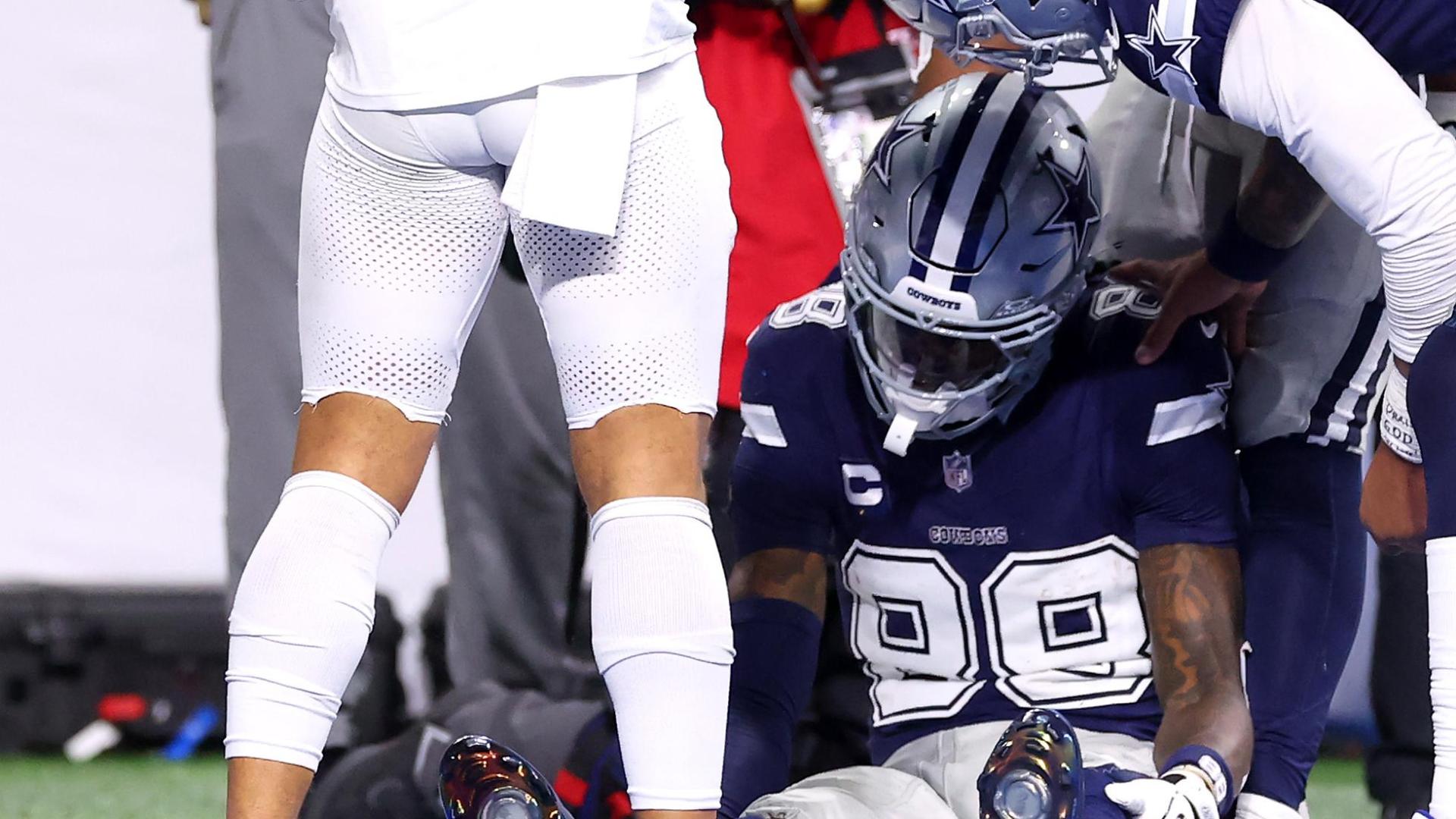 CeeDee Lamb exits after a hard fall