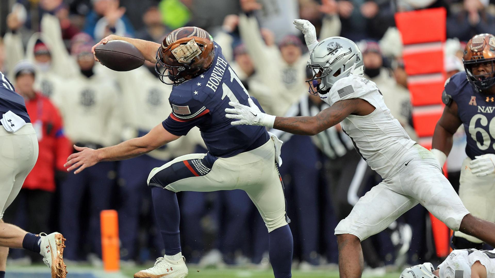 Blake Horvath punches in a Navy TD on the opening drive