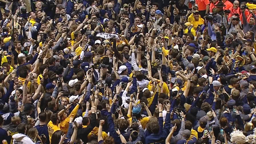 WVU fans storm the court after No. 4 Baylor goes down
