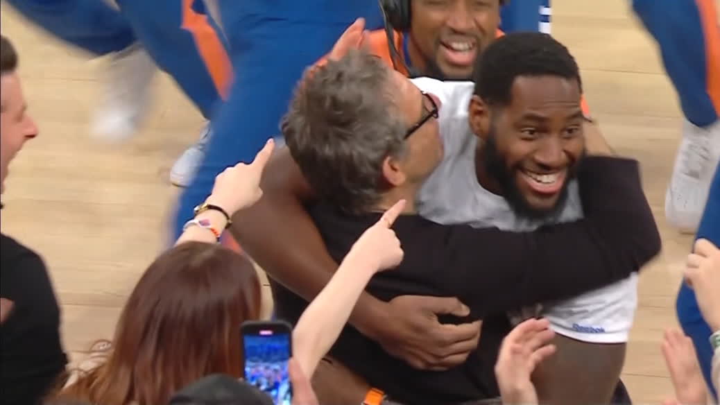 Knicks fan hugs Ben Stiller after sinking half-court shot for a car