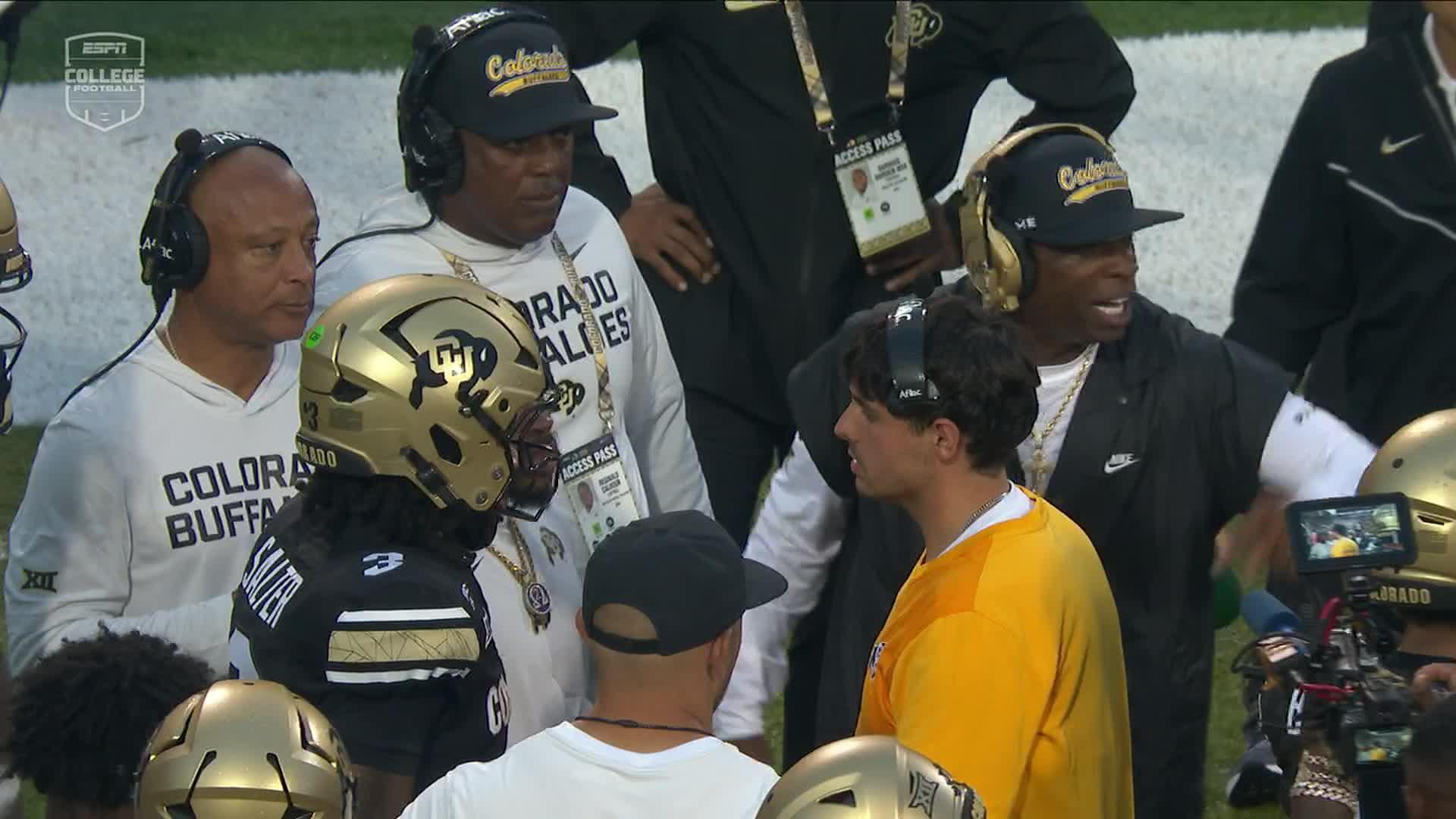 Coach Prime animated on the sideline during a timeout
