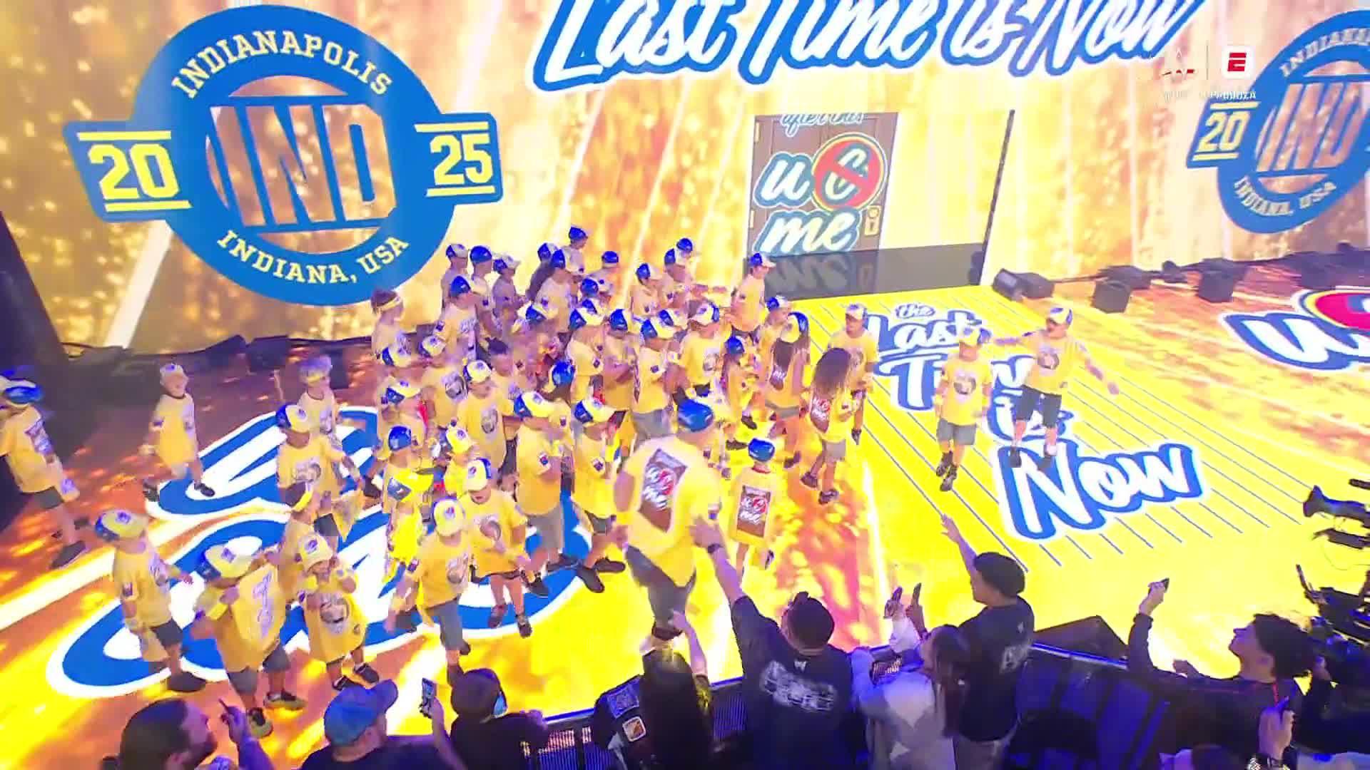 John Cena enters with a crowd of kids