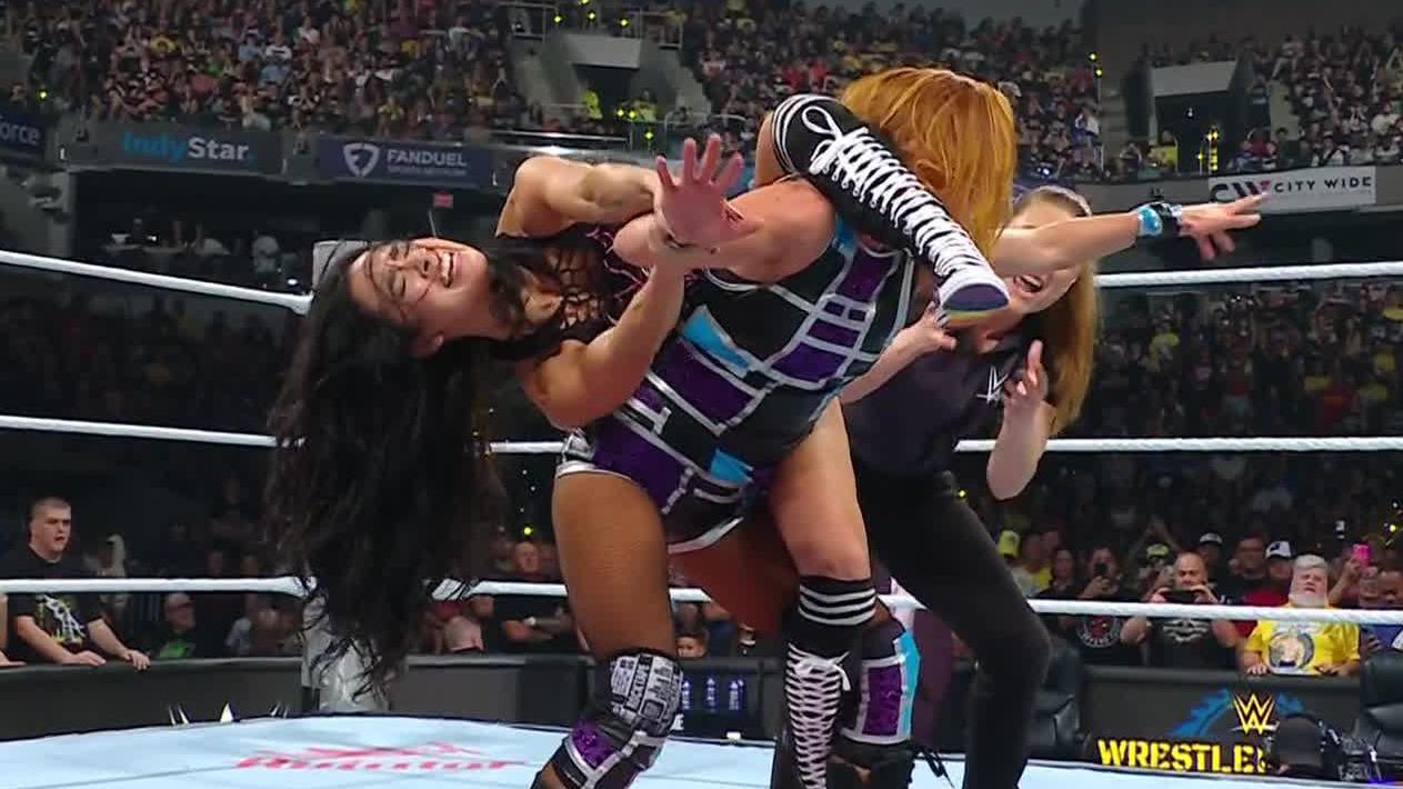 AJ Lee, husband CM Punk come out victorious in mixed tag team match