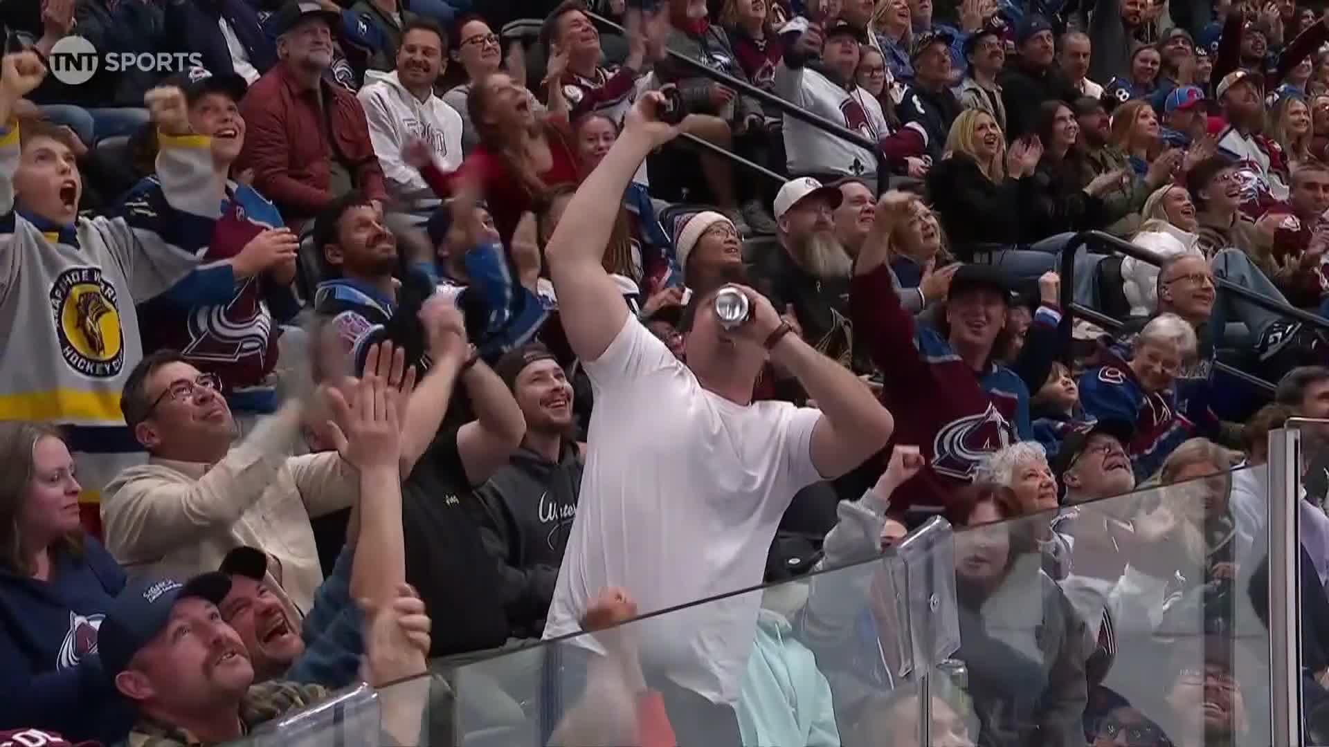 Avalanche fan catches puck and then chugs beer
