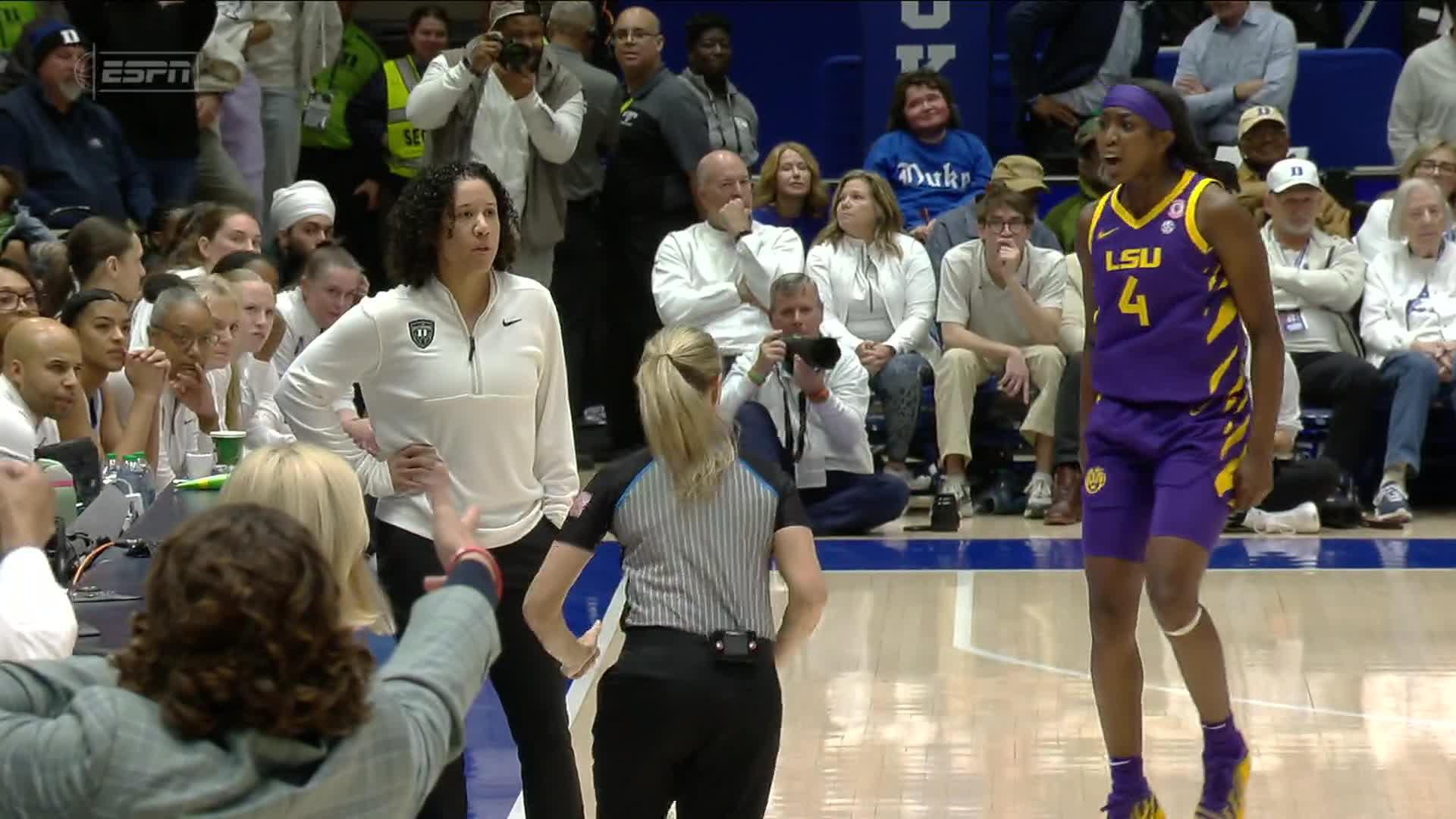 Flau'jae Johnson gets into the face of Kara Lawson after drilling 3